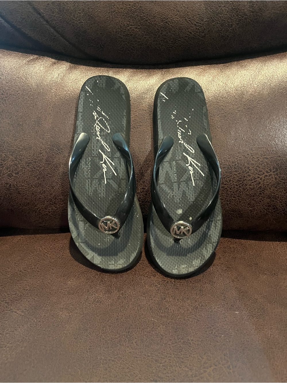 Michael Kors Black Flip Flops with Gold MK Medallion